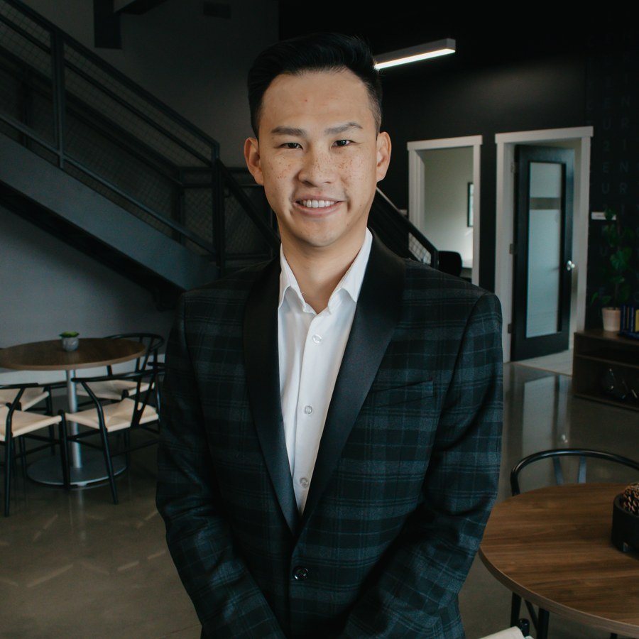CH Tan, owner of Freya Properties, in a professional office setting